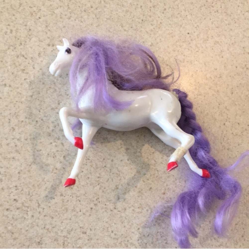 Purple and White Toy Horse with Red Accents